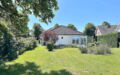 Bungalow-Badendorf-Rückseite und Garten