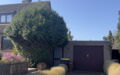 Vorderansicht mit Garage Sonne